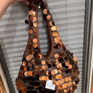 Aldo crochet slouchy bag with shiny sequin disks Velcro closure.